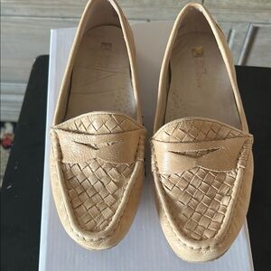 Woman’s tan loafers
